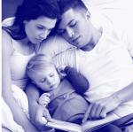 parents reading with baby